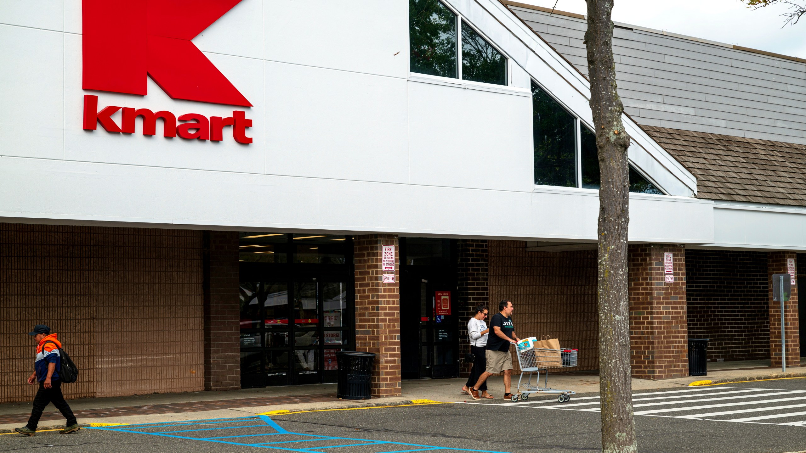 Shoppers leave the K-Mart store in Bridgehampton, N.Y., on Monday, Sept. 23, 2024. (Tom Lambui/Newsday via AP)