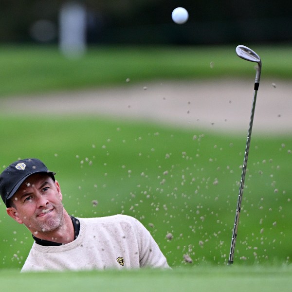 International team member Adam Scott, of Australia, plays a shot from a bunker during a practice round at the Presidents Cup golf tournament at Royal Montreal Golf Club in Montreal, Tuesday, Sept. 24, 2024. (Graham Hughes/The Canadian Press via AP)