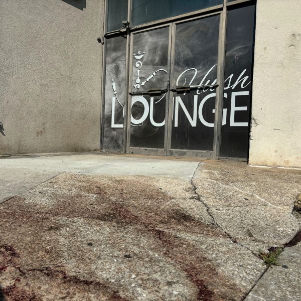 Blood stains were visible on the sidewalk outside of a nightclub in Birmingham, Ala. on Sunday, Sept. 22, 2024, after a mass shooting took place. (AP Photo/Kim Chandler)