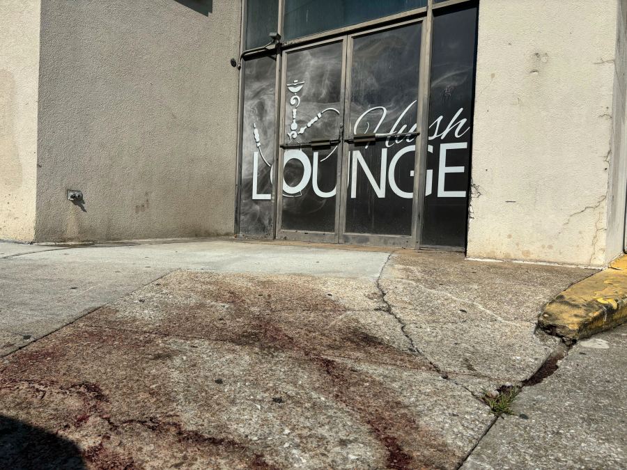 Blood stains were visible on the sidewalk outside of a nightclub in Birmingham, Ala. on Sunday, Sept. 22, 2024, after a mass shooting took place. (AP Photo/Kim Chandler)