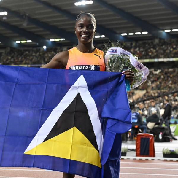 Julien Alfred, of Saint Lucia, poses after winning the women's 100 meters during the Diamond League final 2024 athletics meet in Brussels, Friday, Sept. 13, 2024. (AP Photo/Frederic Sierakowski)