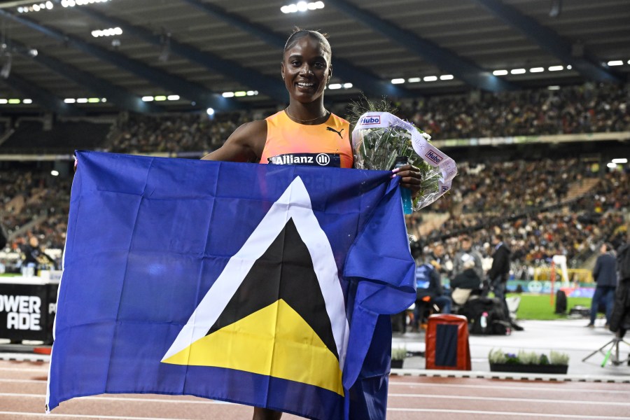 Julien Alfred, of Saint Lucia, poses after winning the women's 100 meters during the Diamond League final 2024 athletics meet in Brussels, Friday, Sept. 13, 2024. (AP Photo/Frederic Sierakowski)