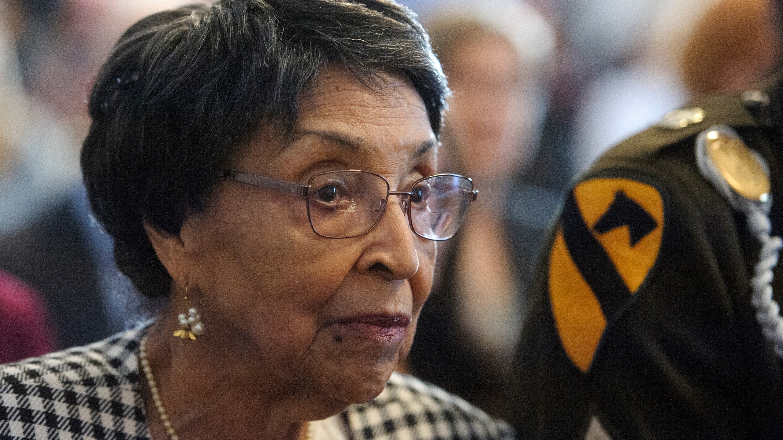 Joann Woodson listens to remarks during a ceremony to posthumously award the Distinguished Service Cross to her husband U.S. Army Staff Sgt. Waverly Woodson Jr., a medic who was part of the only Black combat unit to take part in the D-Day invasion of France during World War II, on Capitol Hill, in Washington, Tuesday, Sept. 24, 2024. (AP Photo/Rod Lamkey, Jr.)