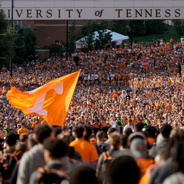 FILE - Tennessee fans gather outside Neyland Stadium before an NCAA college football game between Tennessee and Kent State in Knoxville, Tenn., Sept. 14, 2024. (AP Photo/George Walker IV, File)