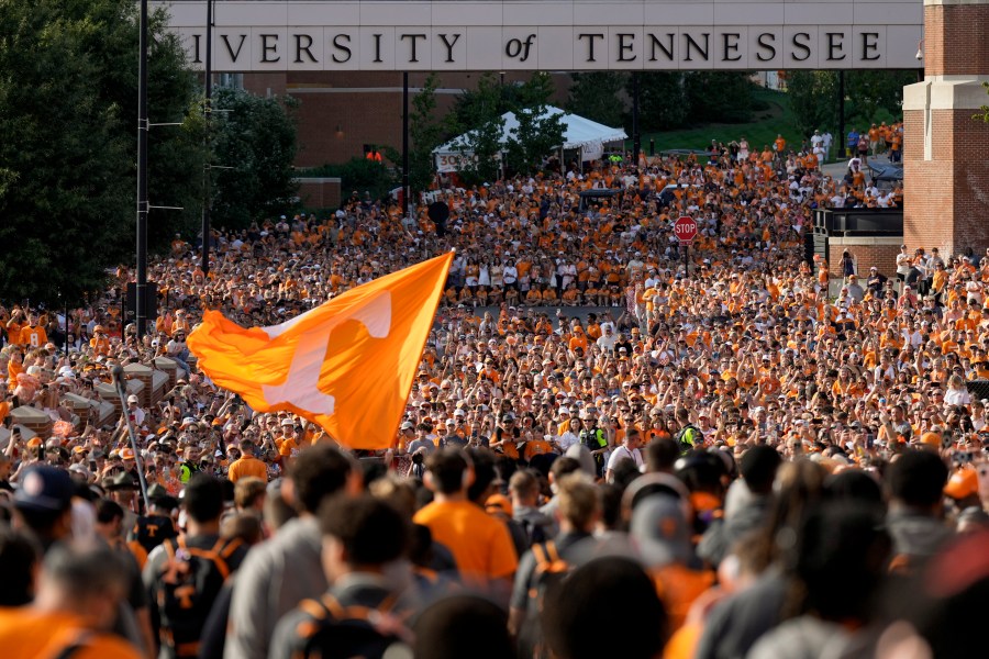 FILE - Tennessee fans gather outside Neyland Stadium before an NCAA college football game between Tennessee and Kent State in Knoxville, Tenn., Sept. 14, 2024. (AP Photo/George Walker IV, File)