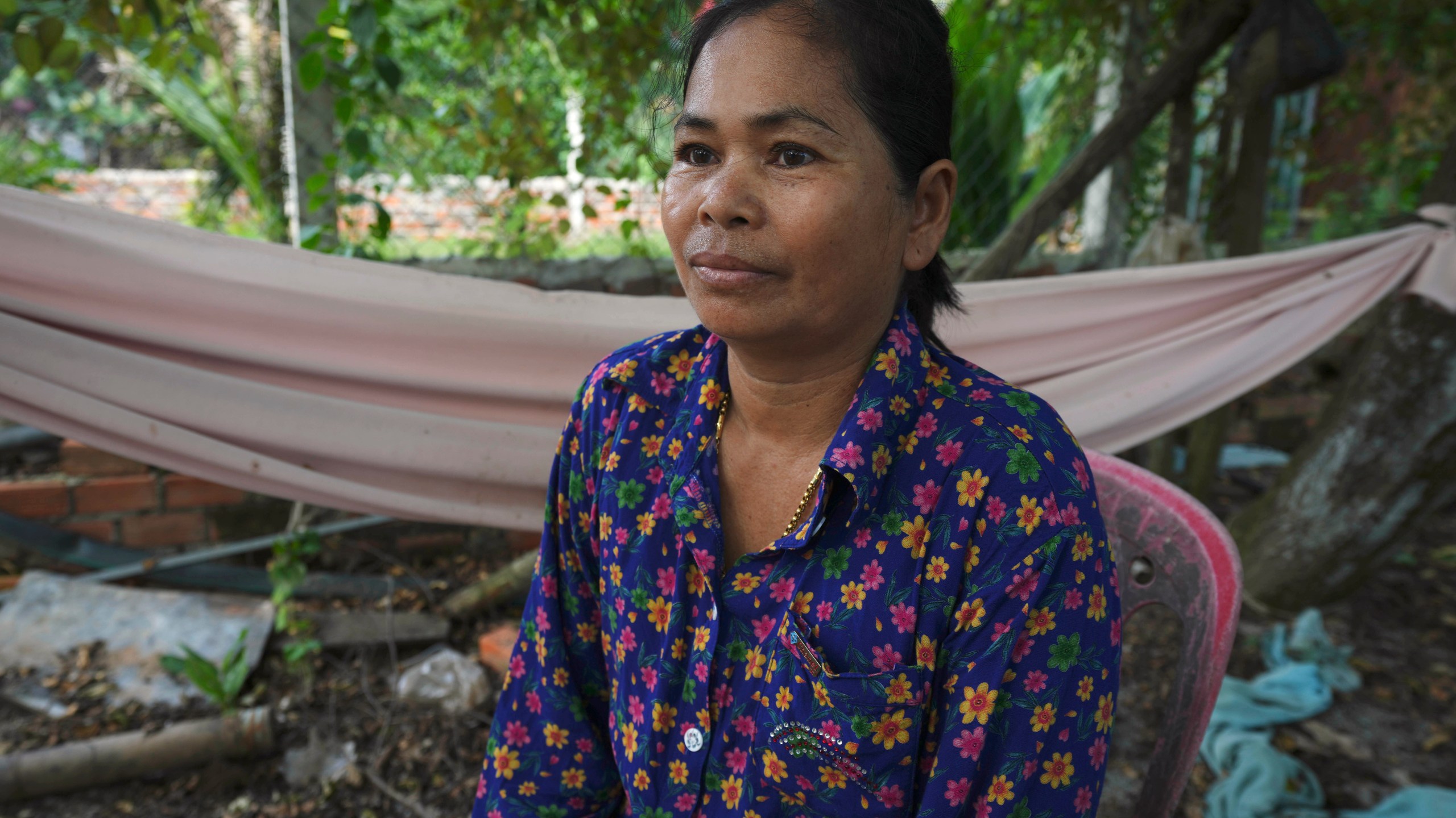 Norng La, a villager who lives along the Funan Techo Canal, is interviewed by The Associated Press at her home at Prek Takeo village eastern Phnom Penh Cambodia, Tuesday, July 30, 2024. (AP Photo/Heng Sinith)