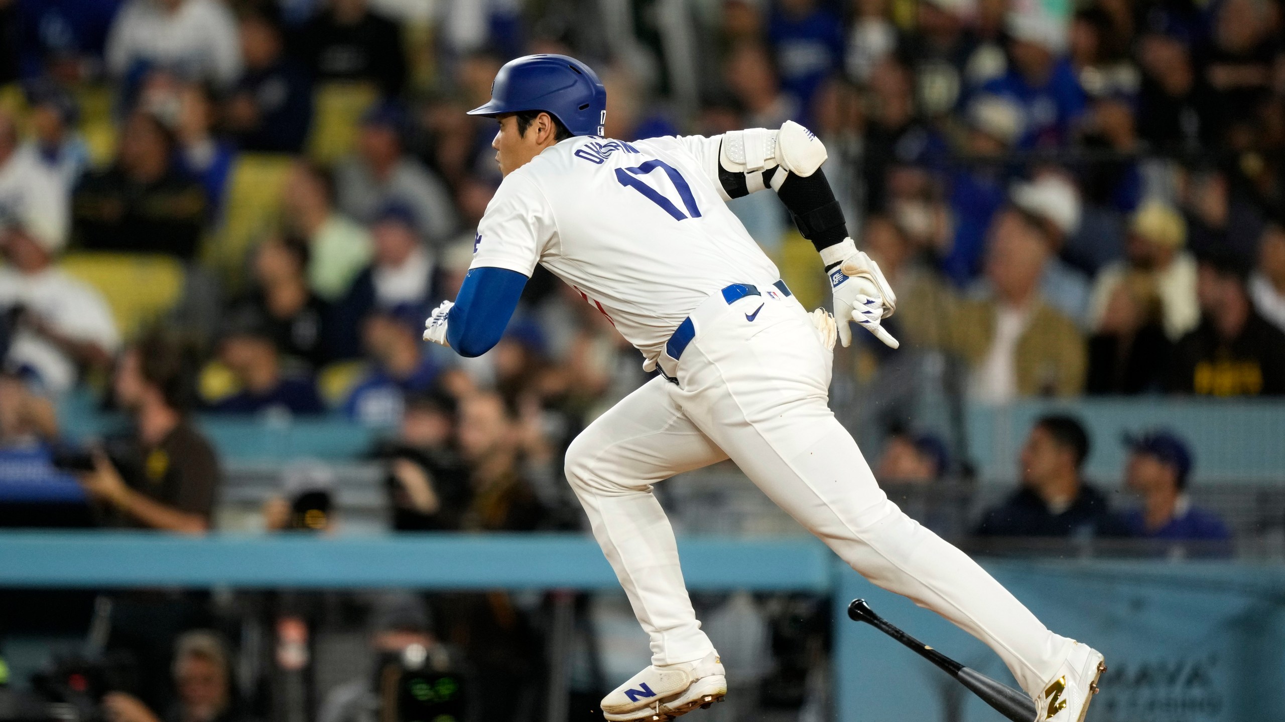 Los Angeles Dodgers' Shohei Ohtani heads to first for a double during the first inning of a baseball game against the San Diego Padres, Tuesday, Sept. 24, 2024, in Los Angeles. (AP Photo/Mark J. Terrill)