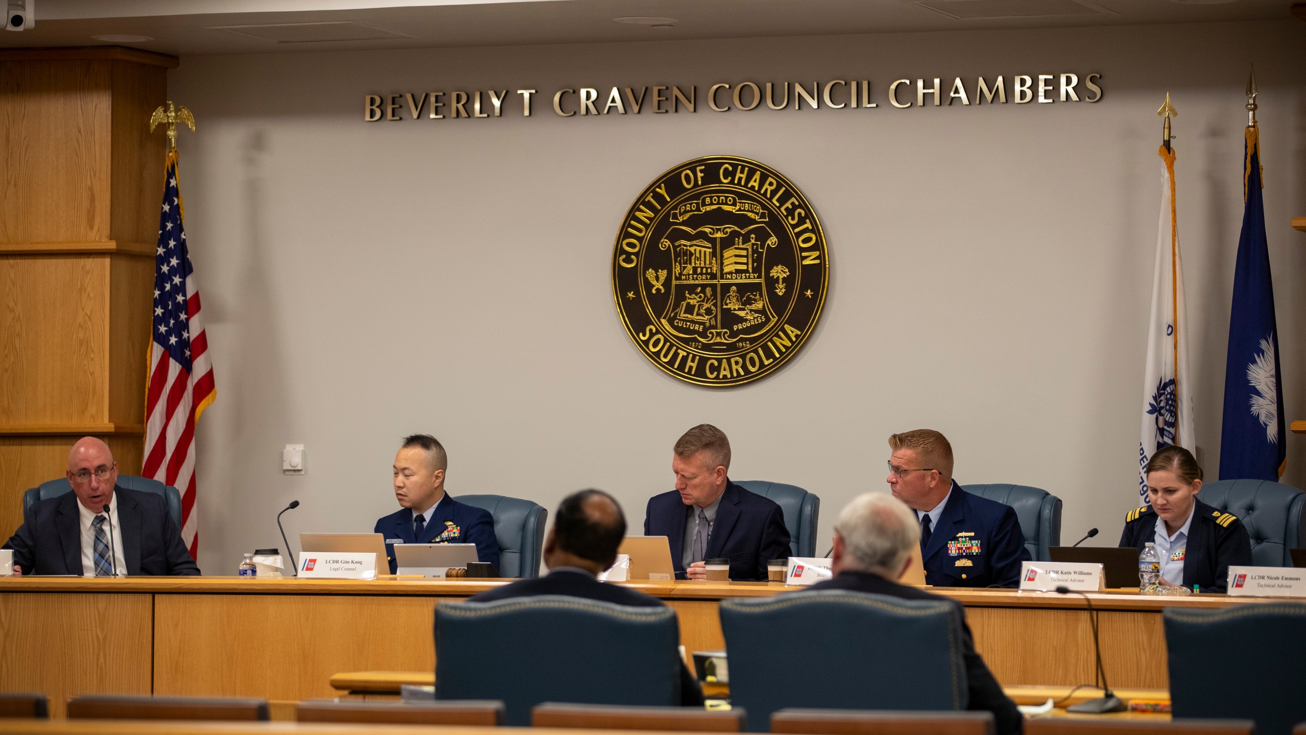 Members of the Coast Guard's Titan Submersible Marine Board of Investigation listen during the formal hearing inside the Charleston County Council Chambers, Monday, Sept. 23, 2024, in North Charleston, S.C. (Laura Bilson/The Post And Courier via AP, Pool)