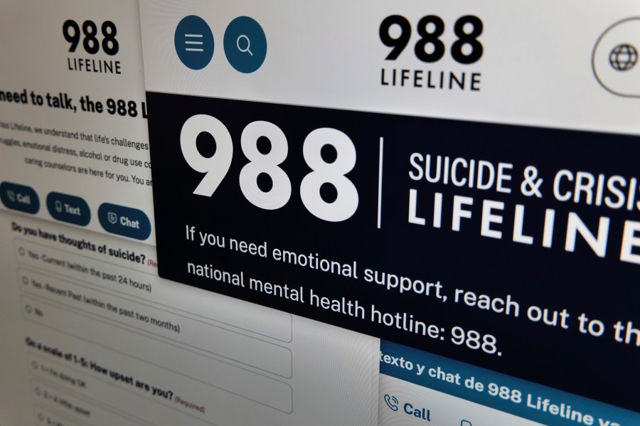 Pages from the U.S. 988 Suicide & Crisis Lifeline website are arranged for a photograph in New York on Tuesday, Sept. 24, 2024. (AP Photo/Patrick Sison)