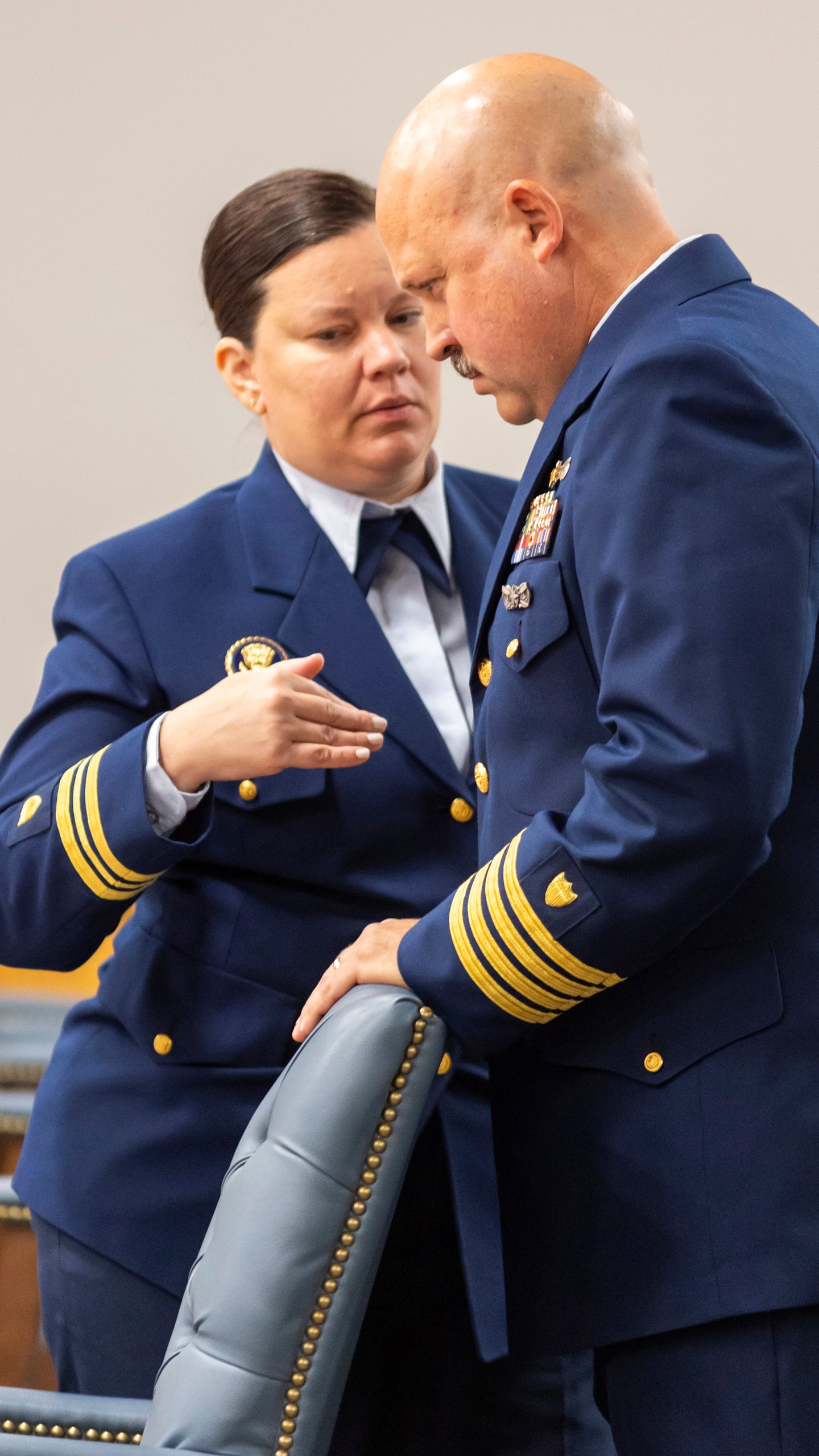 Jamie Frederick, at right, with the U.S. Coast Guard Sector Boston, speaks with Coast Guard legal counsel Jessie Brenton during a break during the final day of the Coast Guard investigatory hearing on the causes of the implosion of an experimental submersible headed for the wreck of the Titanic, Friday, Sept. 27, 2024, in North Charleston, S.C. (AP Photo/Mic Smith)