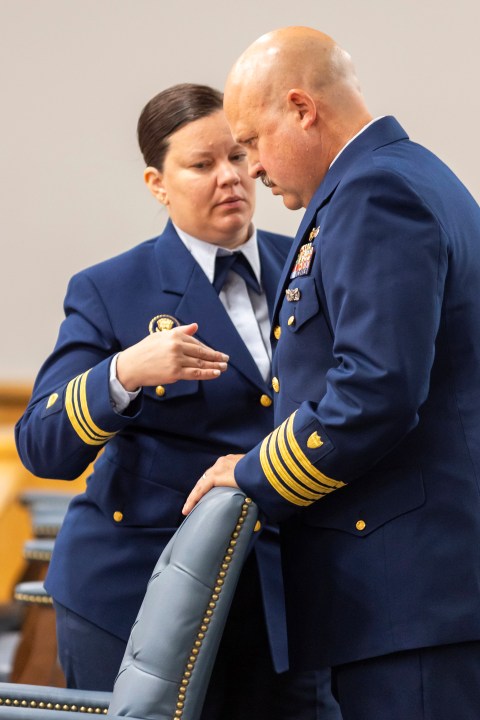 Jamie Frederick, at right, with the U.S. Coast Guard Sector Boston, speaks with Coast Guard legal counsel Jessie Brenton during a break during the final day of the Coast Guard investigatory hearing on the causes of the implosion of an experimental submersible headed for the wreck of the Titanic, Friday, Sept. 27, 2024, in North Charleston, S.C. (AP Photo/Mic Smith)