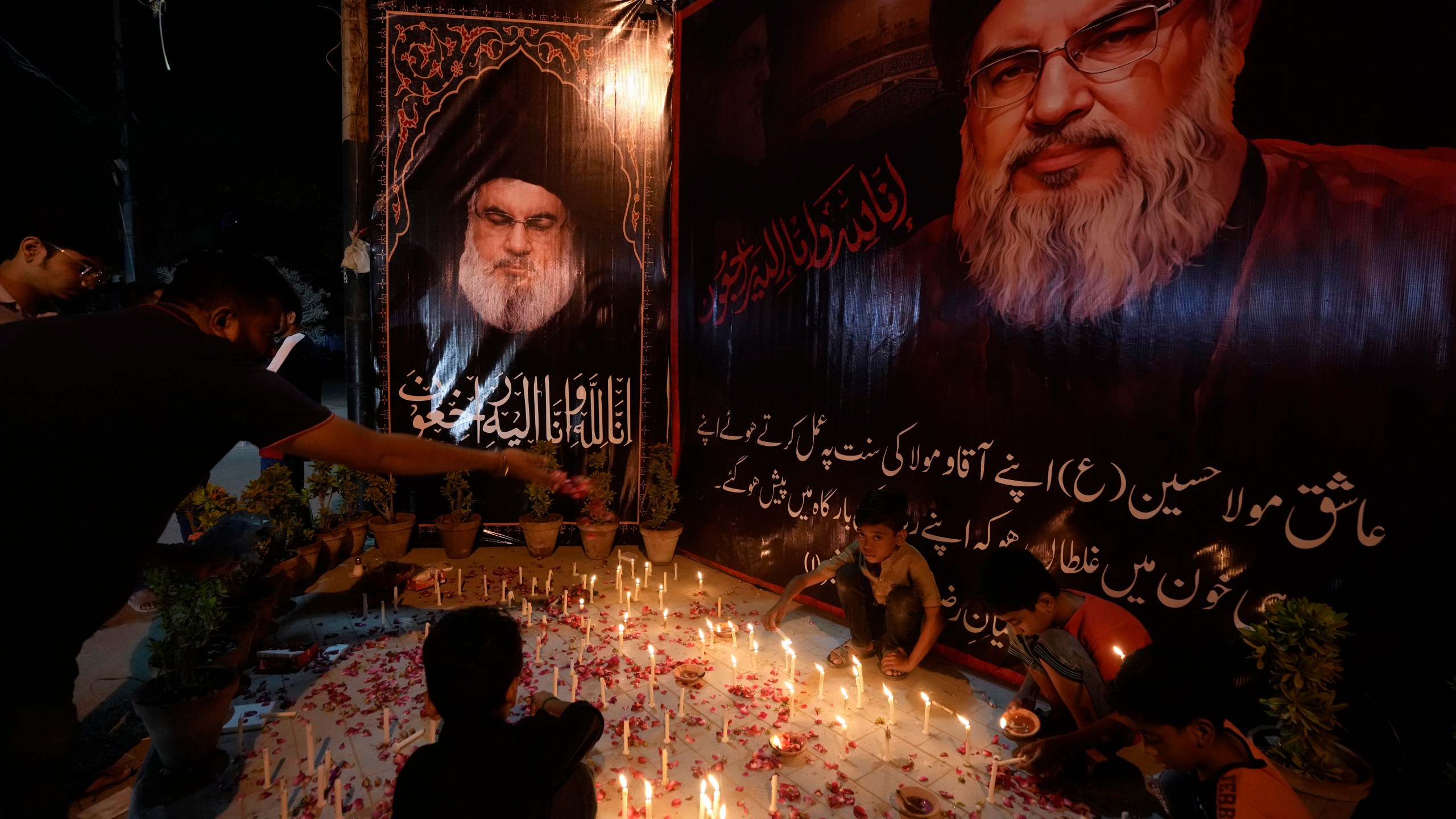 Shiite Muslims light candles during a protest against the killing of Hezbollah leader Hassan Nasrallah, in Karachi, Pakistan, Saturday, Sept. 28, 2024. (AP Photo/Fareed Khan)