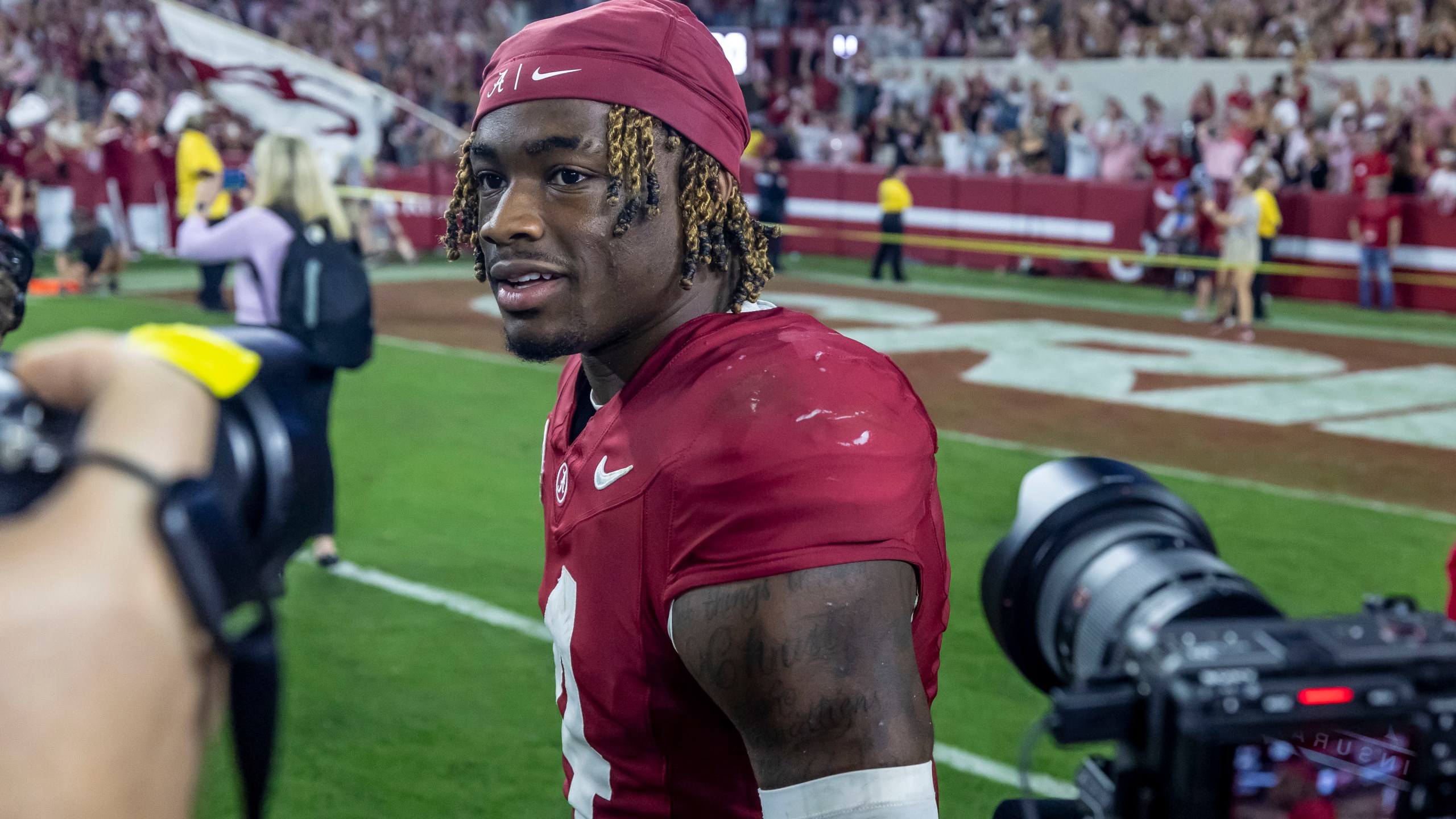 Alabama quarterback Jalen Milroe (4) walks on the field after the team won against Georgia in an NCAA college football game, Saturday, Sept. 28, 2024, in Tuscaloosa, Ala. (AP Photo/Vasha Hunt)