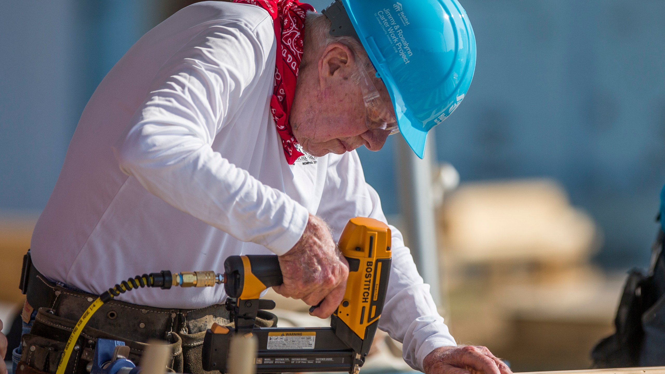 FILE- In this Aug. 27, 2018 file photo, former President Jimmy Carter works with other volunteers on site during the first day of the weeklong Jimmy & Rosalynn Carter Work Project, their 35th work project with Habitat for Humanity, in Mishawaka, Ind. Carter turns 95 on Tuesday, Oct. 1, 2019. (Robert Franklin/South Bend Tribune via AP, File)