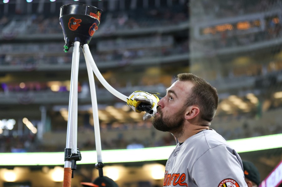 Baltimore Orioles' Colton Cowser celebrates after his solo home run during the seventh inning of a baseball game against the Minnesota Twins, Friday, Sept. 27, 2024, in Minneapolis. (AP Photo/Matt Krohn)