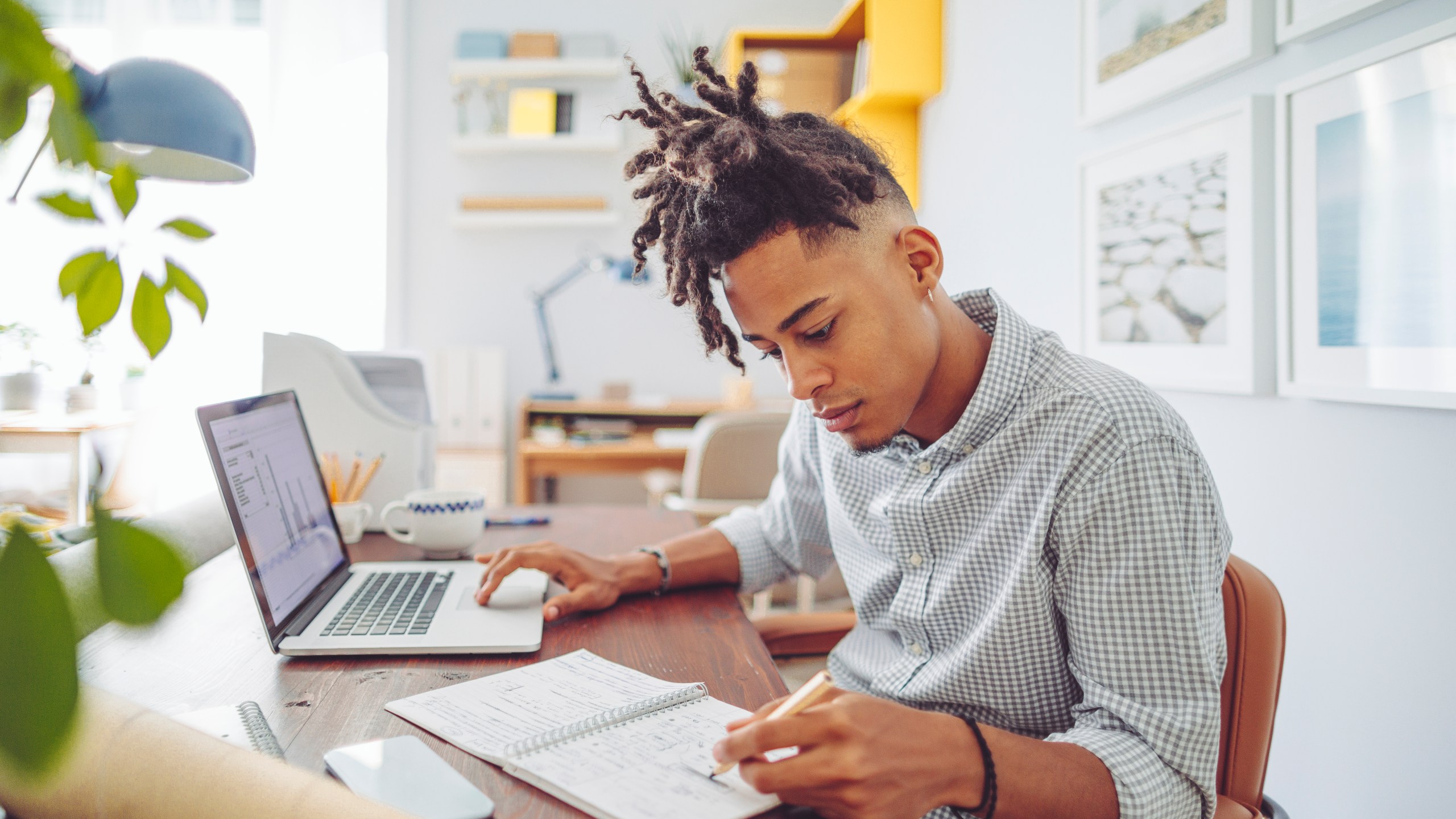 A student does homework with the help of a computer.