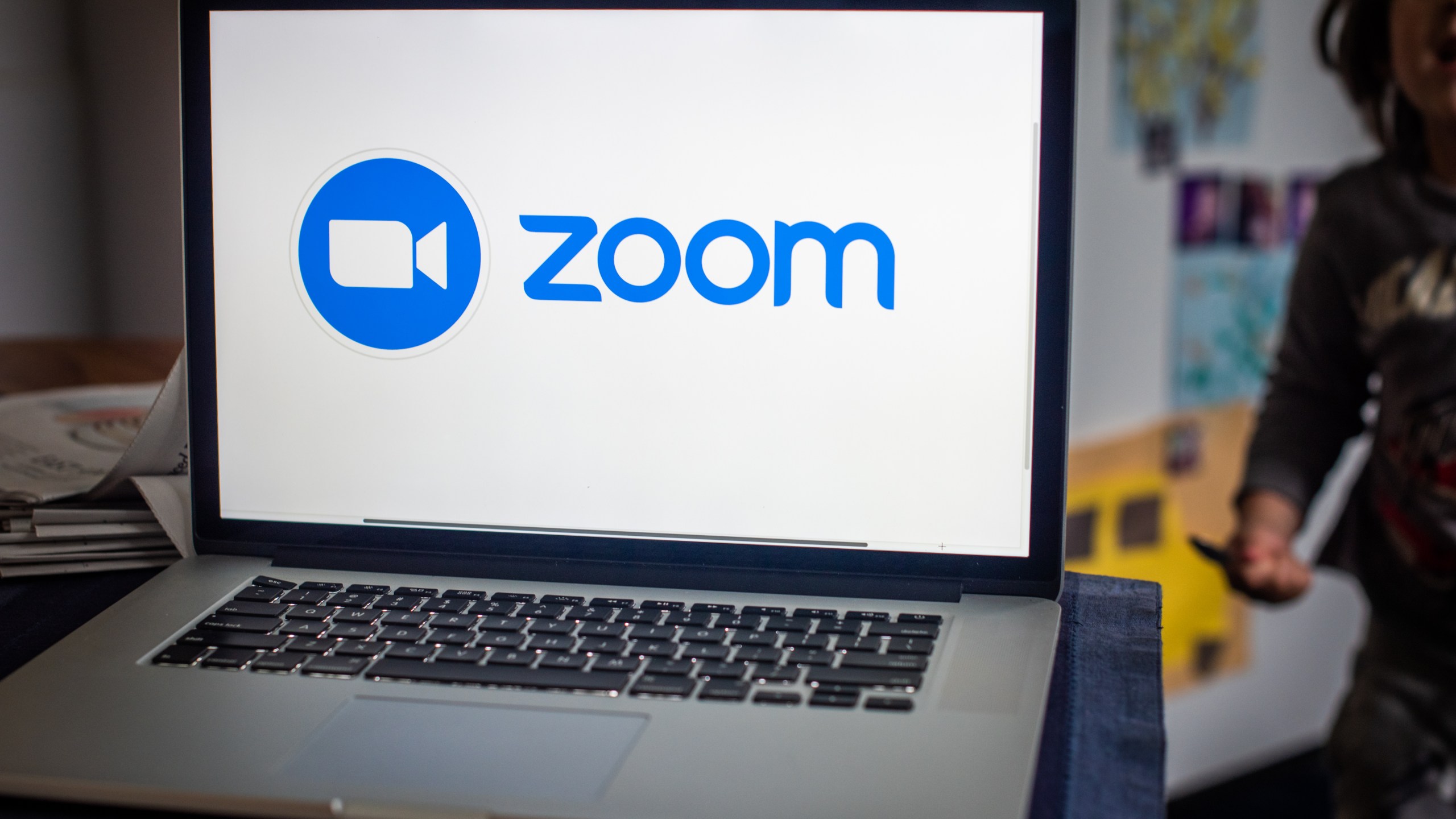 The Zoom Video Communications logo on a laptop computer.