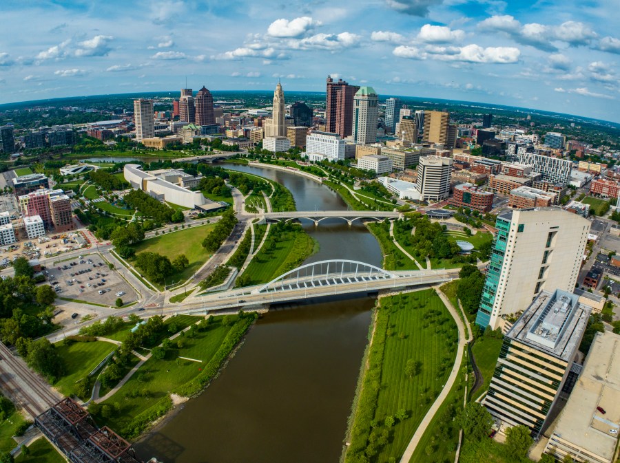 Skyline view of bridges crossing Scioto River that runs through Columbus, Ohio.