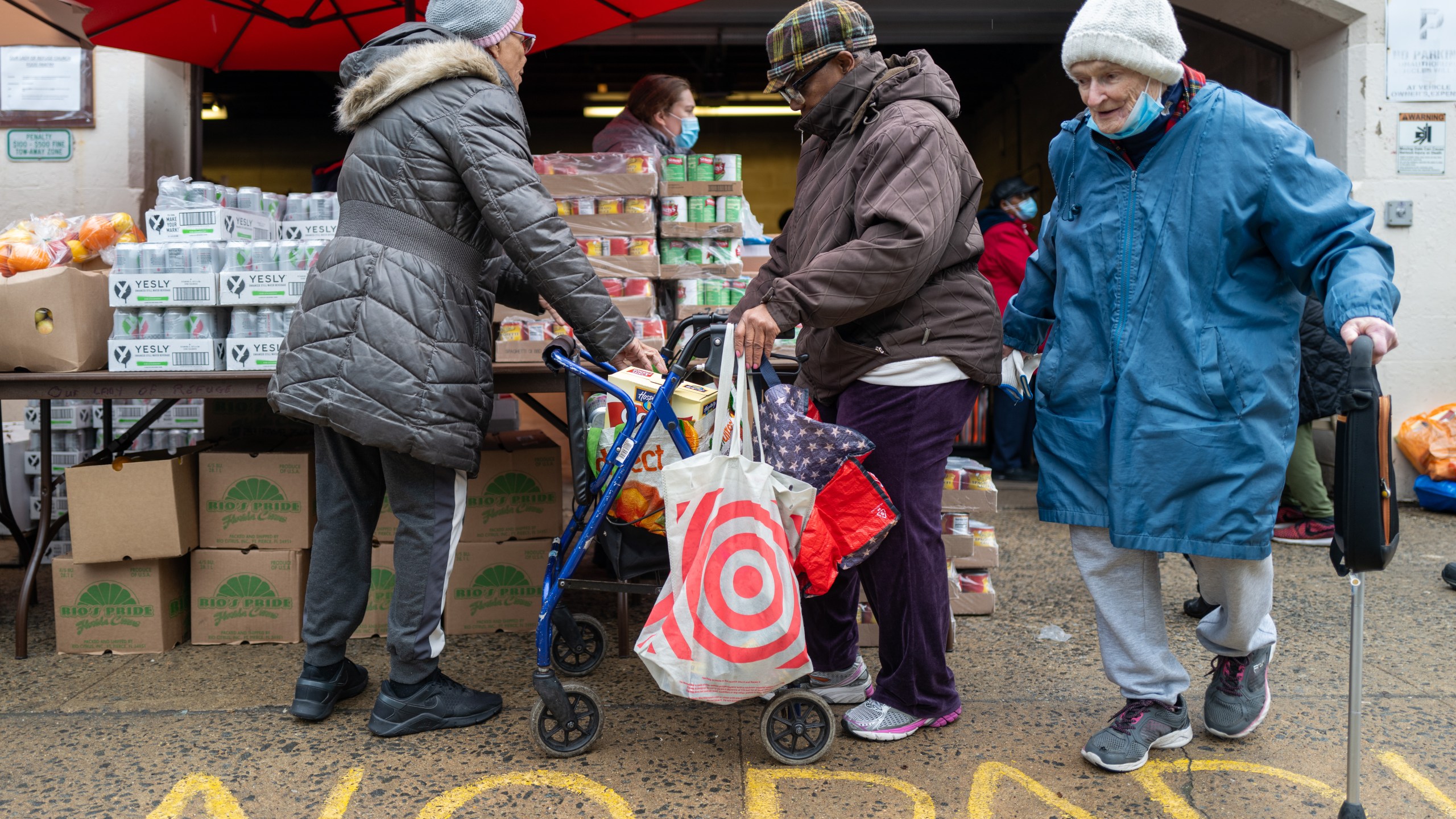 Free food is distributed to residents in need at a weekly food bank in Brooklyn, New York.