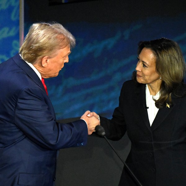 Democratic presidential candidate Kamala Harris (R) shakes hands with former US President and Republican presidential candidate Donald Trump during the presidential debate