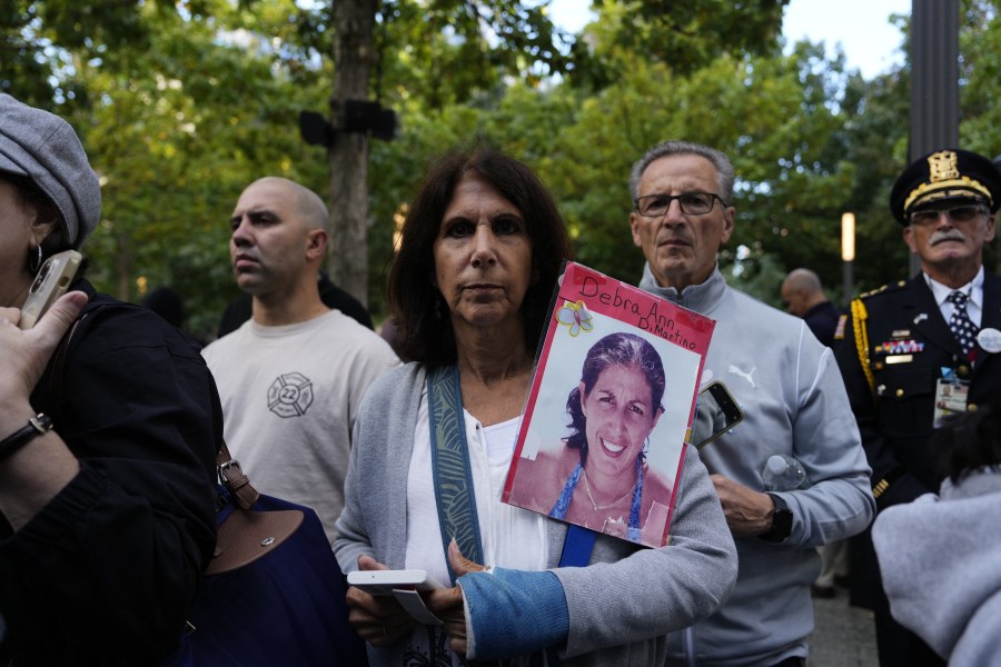 People attend a remembrance ceremony on the 23rd anniversary of the September 11 terror attack on the World Trade Center at Ground Zero, in New York City on September 11, 2024. 