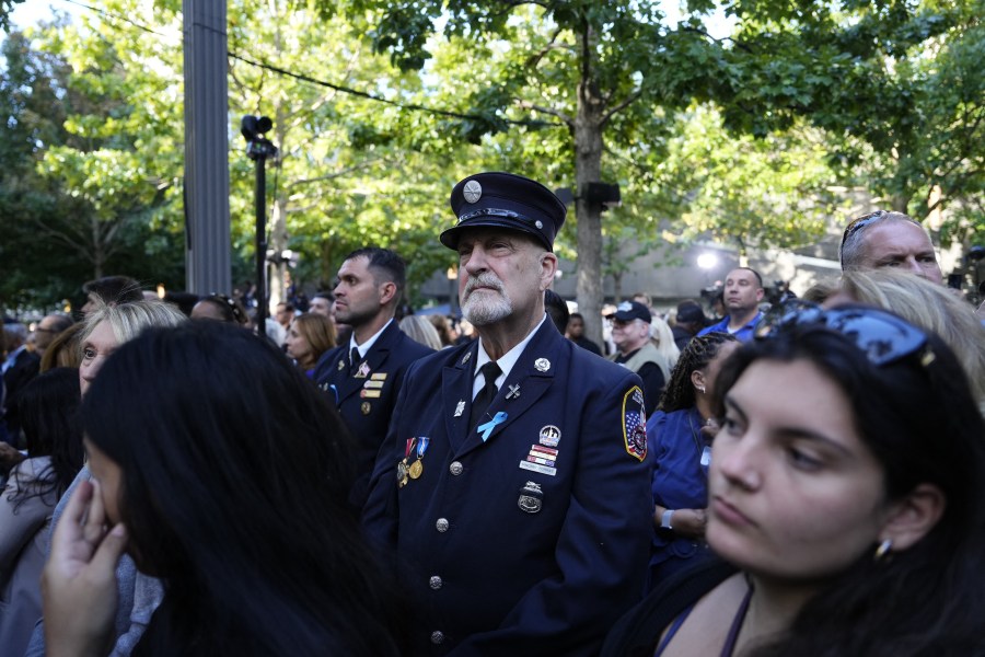 People attend a remembrance ceremony on the 23rd anniversary of the September 11 terror attack on the World Trade Center at Ground Zero, in New York City on September 11, 2024. 