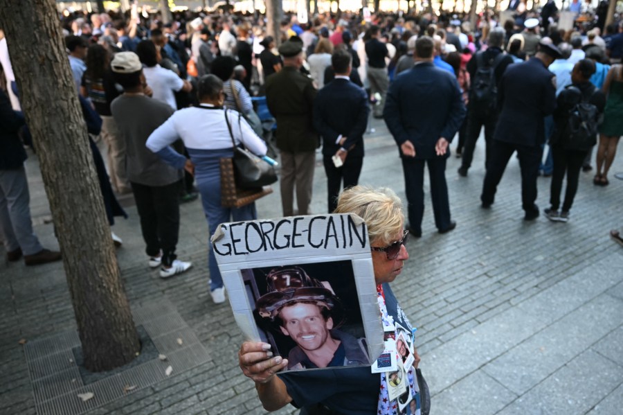 People attend a remembrance ceremony on the 23rd anniversary of the September 11 terror attack on the World Trade Center at Ground Zero, in New York City on September 11, 2024. 