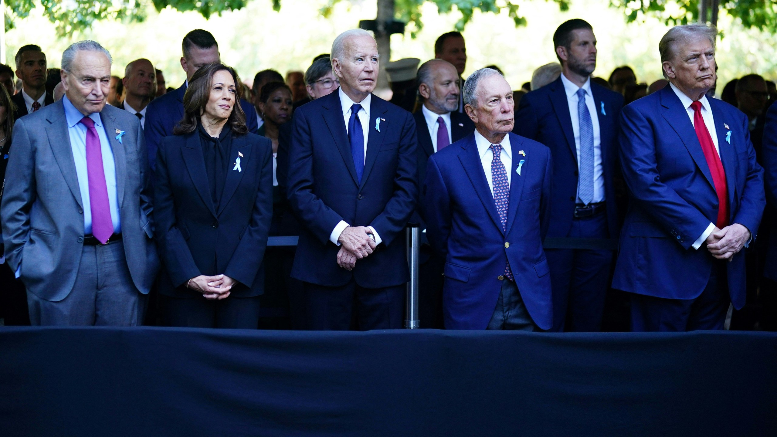 (L to R) Senate Majority Leader Chuck Schumer (D-NY), US Vice President and Democratic presidential candidate Kamala Harris, US President Joe Biden, former Mayor of New York Michael Bloomberg and former US President and Republican presidential candidate Donald Trump attend a remembrance ceremony on the 23rd anniversary of the September 11 terror attack on the World Trade Center at Ground Zero, in New York City on September 11, 2024.