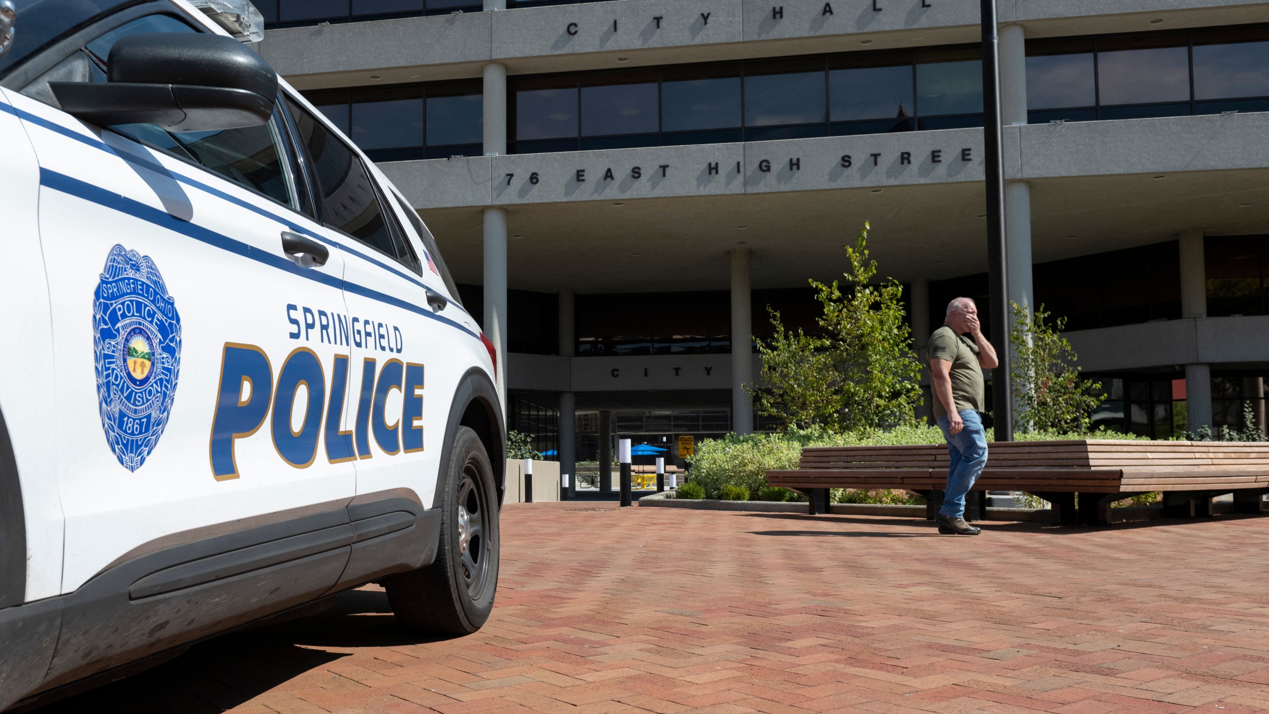 A man walks past the Springfield City Hall after bomb threats were made against buildings earlier in the day in Springfield, Ohio on September 12, 2024.