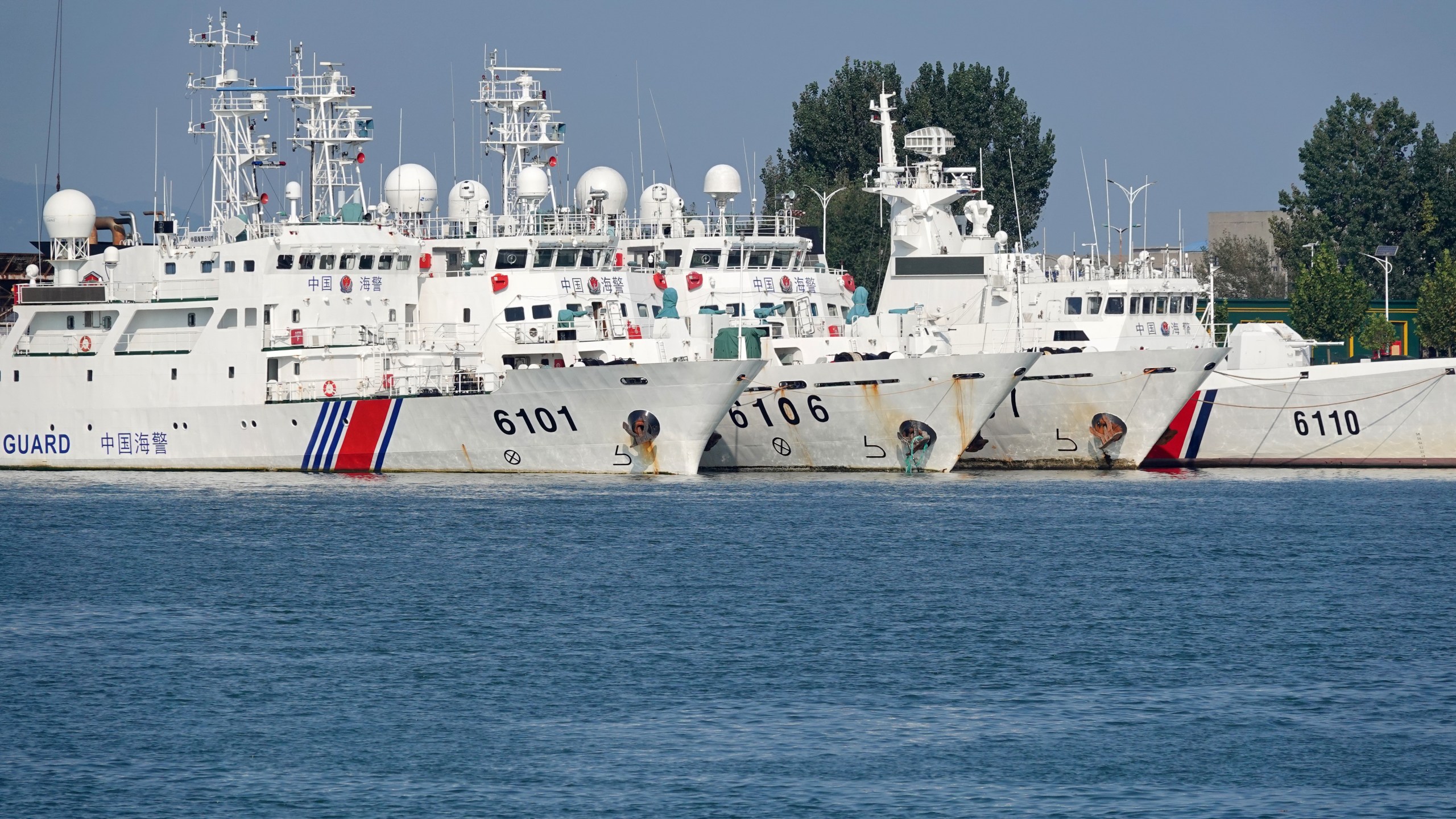 Coast guard ships are seen at a dock in Yantai, China, on September 26, 2024.