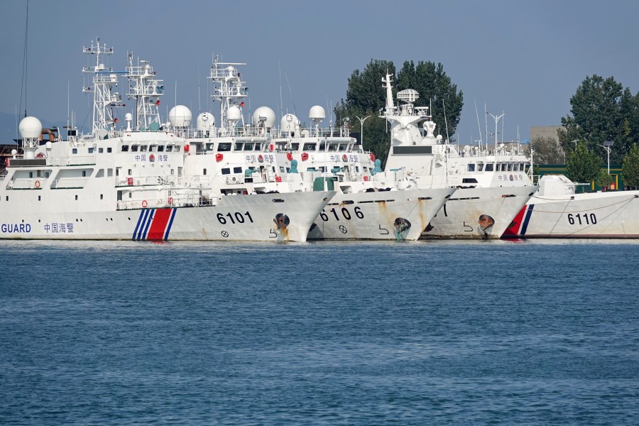 Coast guard ships are seen at a dock in Yantai, China, on September 26, 2024.