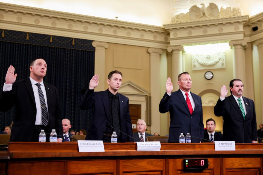 Edward Lenz, sergeant at the Adams Township Police Department and commander of the Butler County Emergency Services Unit, from left, Drew Blasko, patrolman of the Butler Township Police Department, John Herold, Pennsylvania State Police lieutenant, and Patrick Sullivan, former US Secret Service agent, are sworn in during a hearing with the full task force on the assassination attempt of former President Donald J. Trump in Butler, Pennsylvania, on Capitol Hill in Washington, DC, US, on Thursday, Sept. 26, 2024.