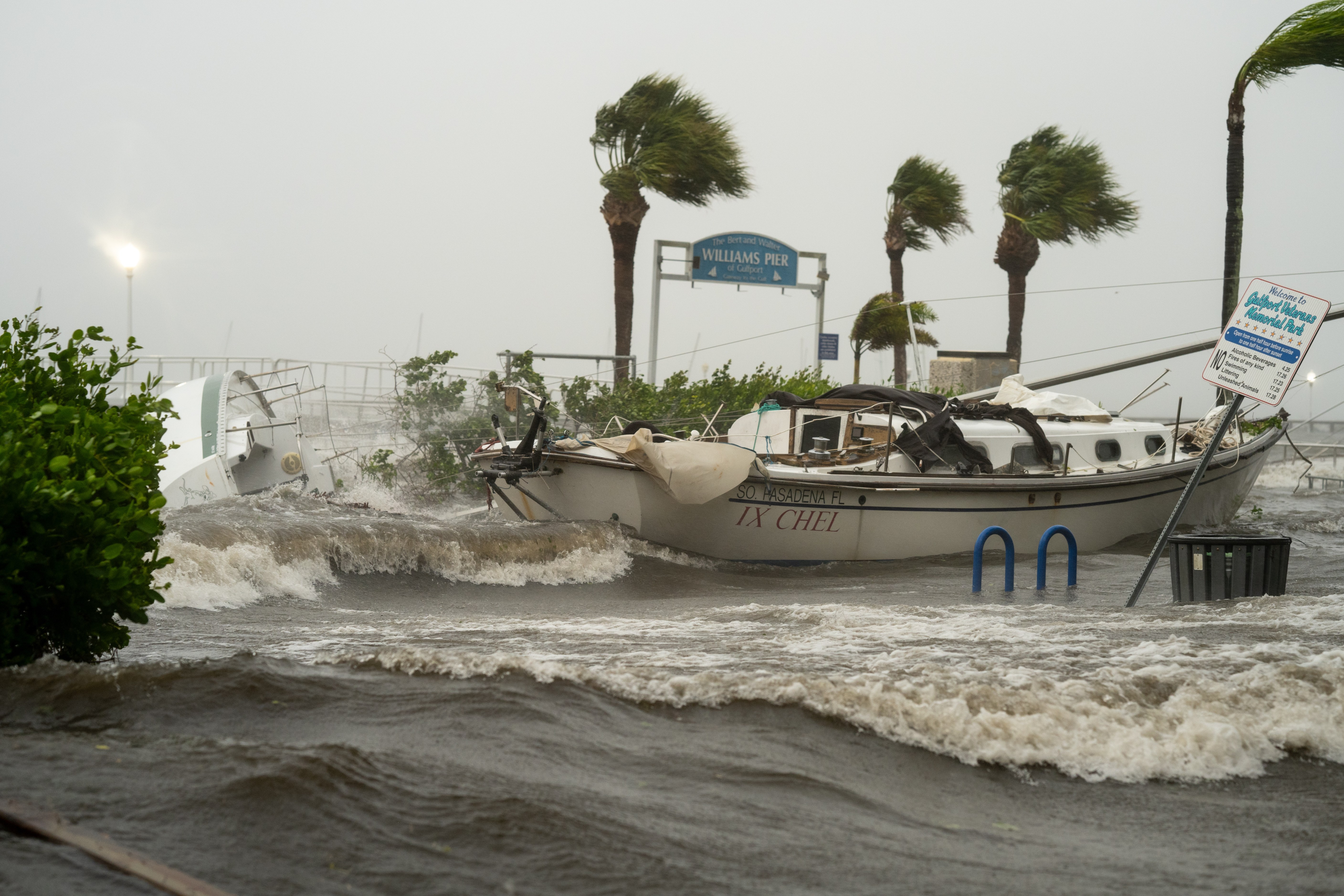 A boat washed ashore as storm surge affects Gulfport, Fla. as Hurricane Helene passed through the Gulf of Mexico to the West on September 26, 2024.