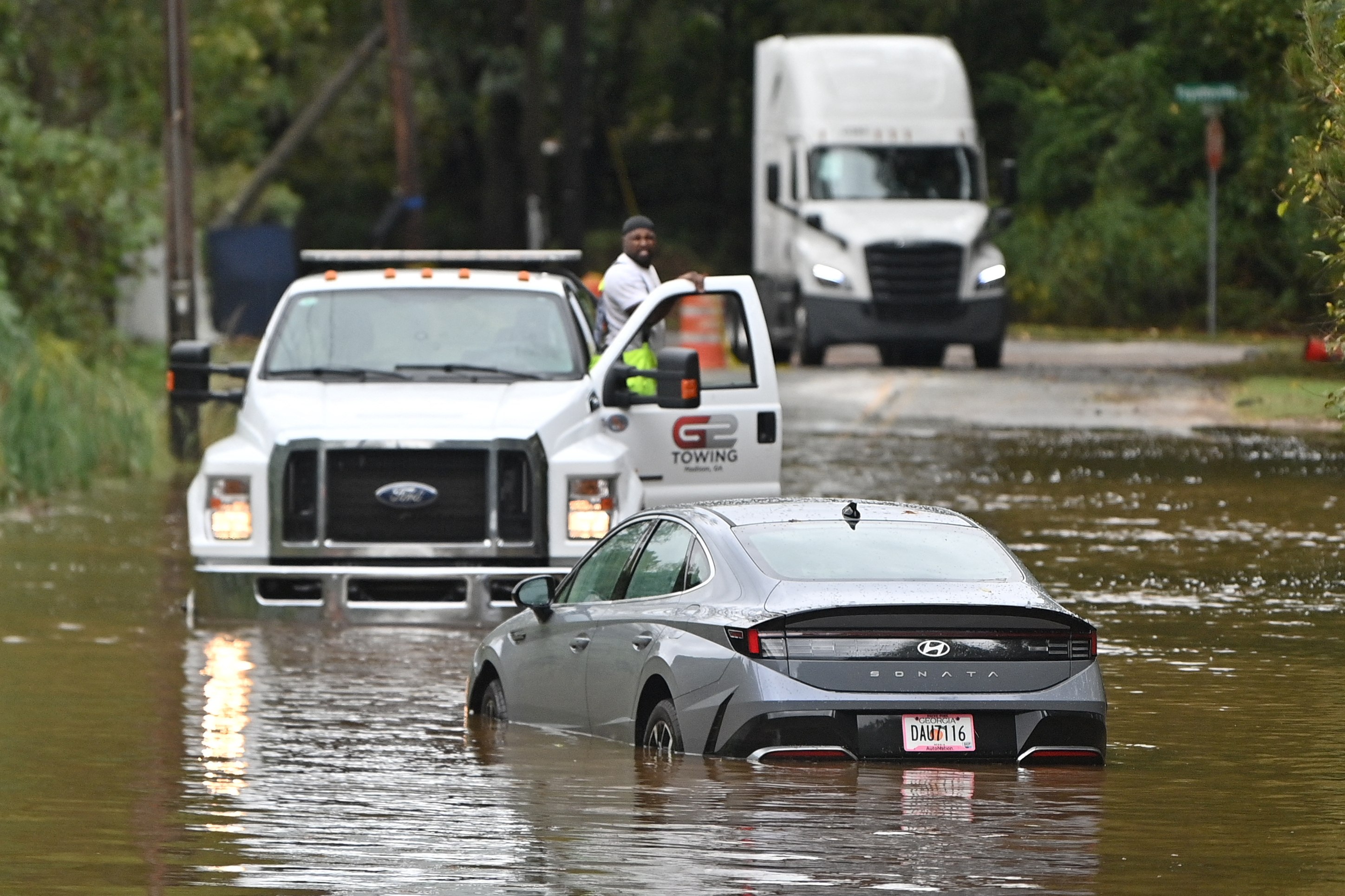 A car in a flooded street is seen after Hurricane Helene made landfall in Atlanta, Georgia, on September 27, 2024.