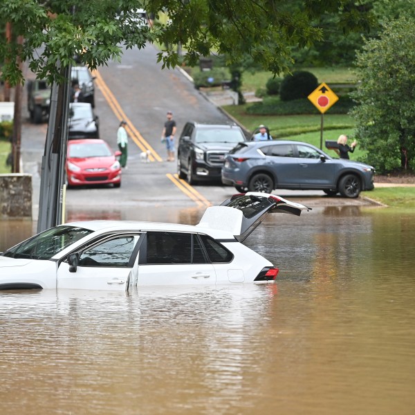 A car in a flooded street is seen after Hurricane Helene made landfall in Atlanta, Georgia, on September 27, 2024.