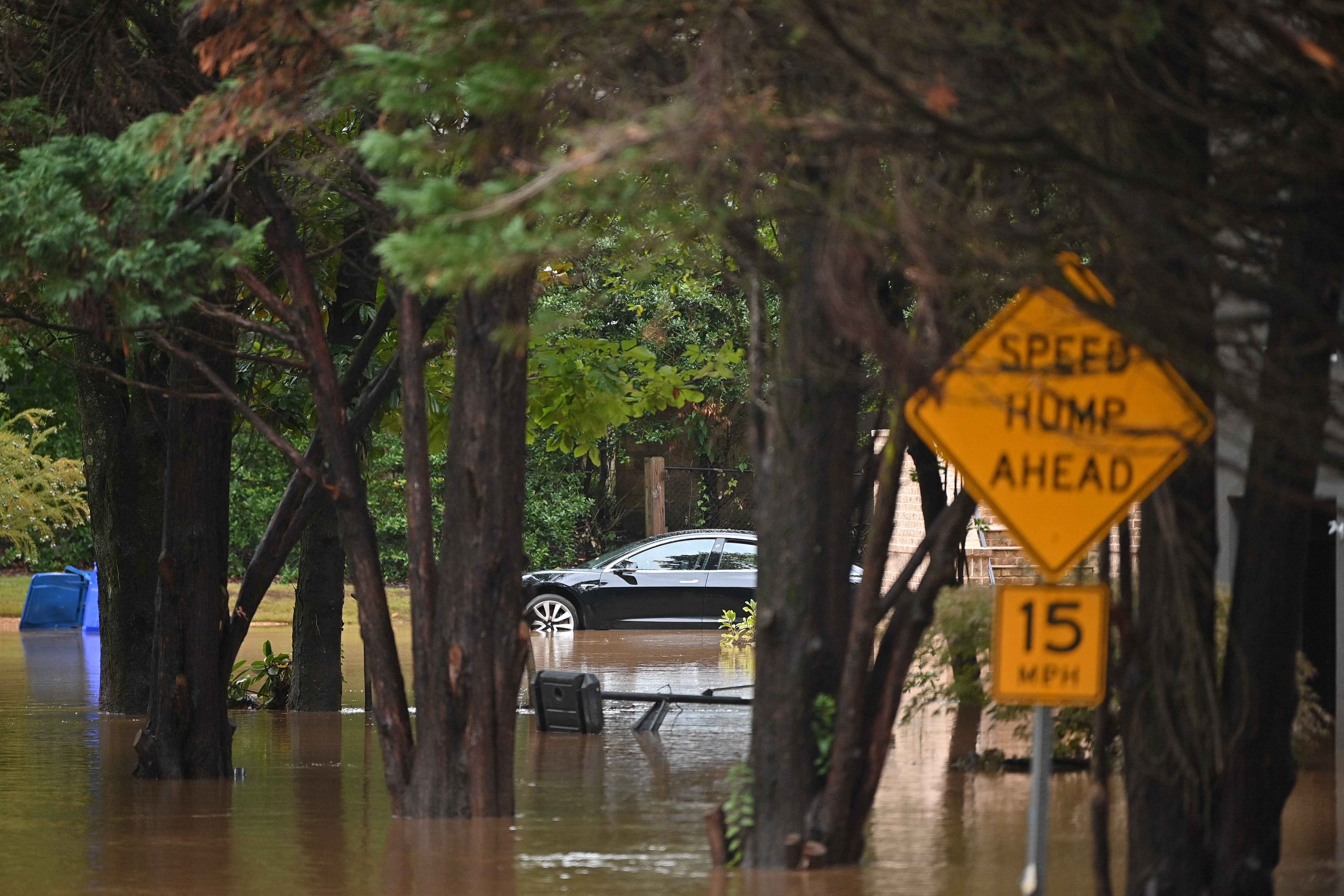 A car in a flooded street is seen after Hurricane Helene made landfall in Atlanta, Georgia, on September 27, 2024.