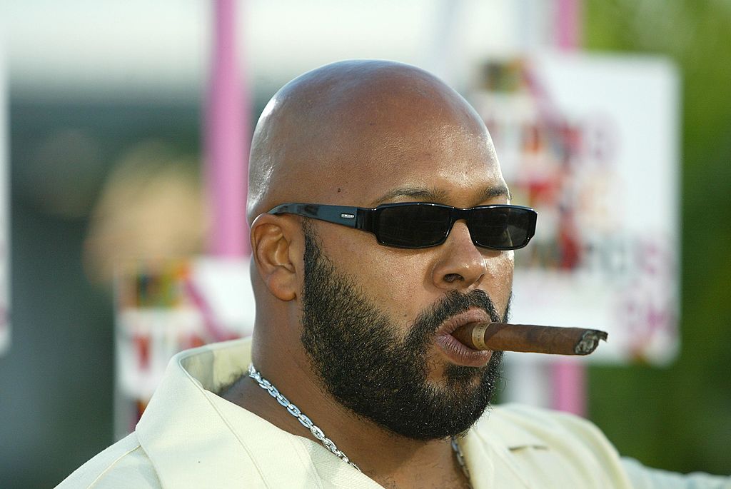 Former Death Row Records CEO Suge Knight prior to his incarceration, smokes a cigar