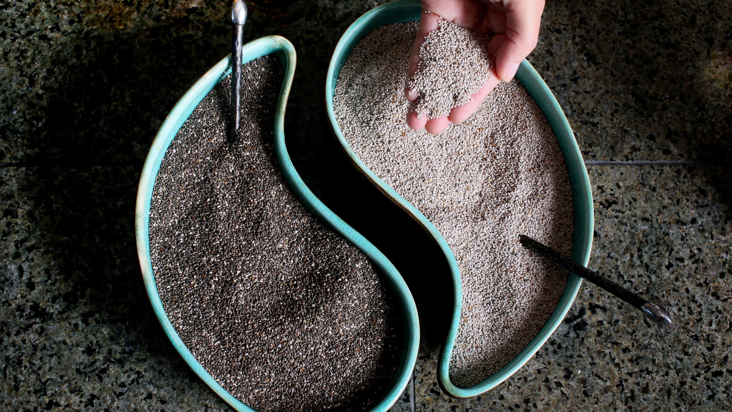 Black and White Chia seeds sit in dishes