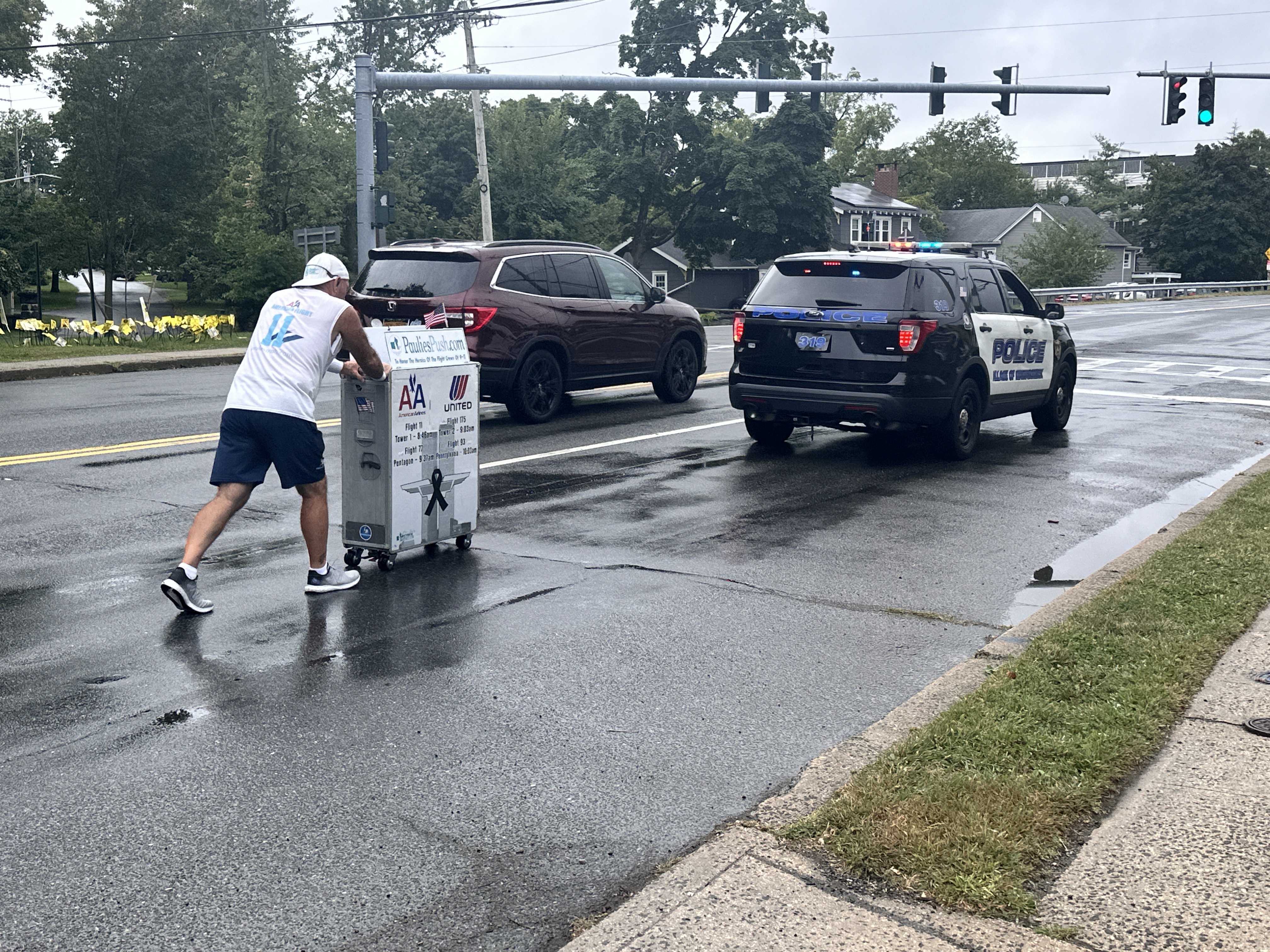 Former flight attendant Paul Veneto pushes an airline drink cart along the routes of the four airplanes hijacked on Sept. 11, 2001.