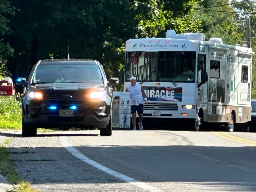 Former flight attendant Paul Veneto pushes an airline drink cart along the routes of the four airplanes hijacked on Sept. 11, 2001.