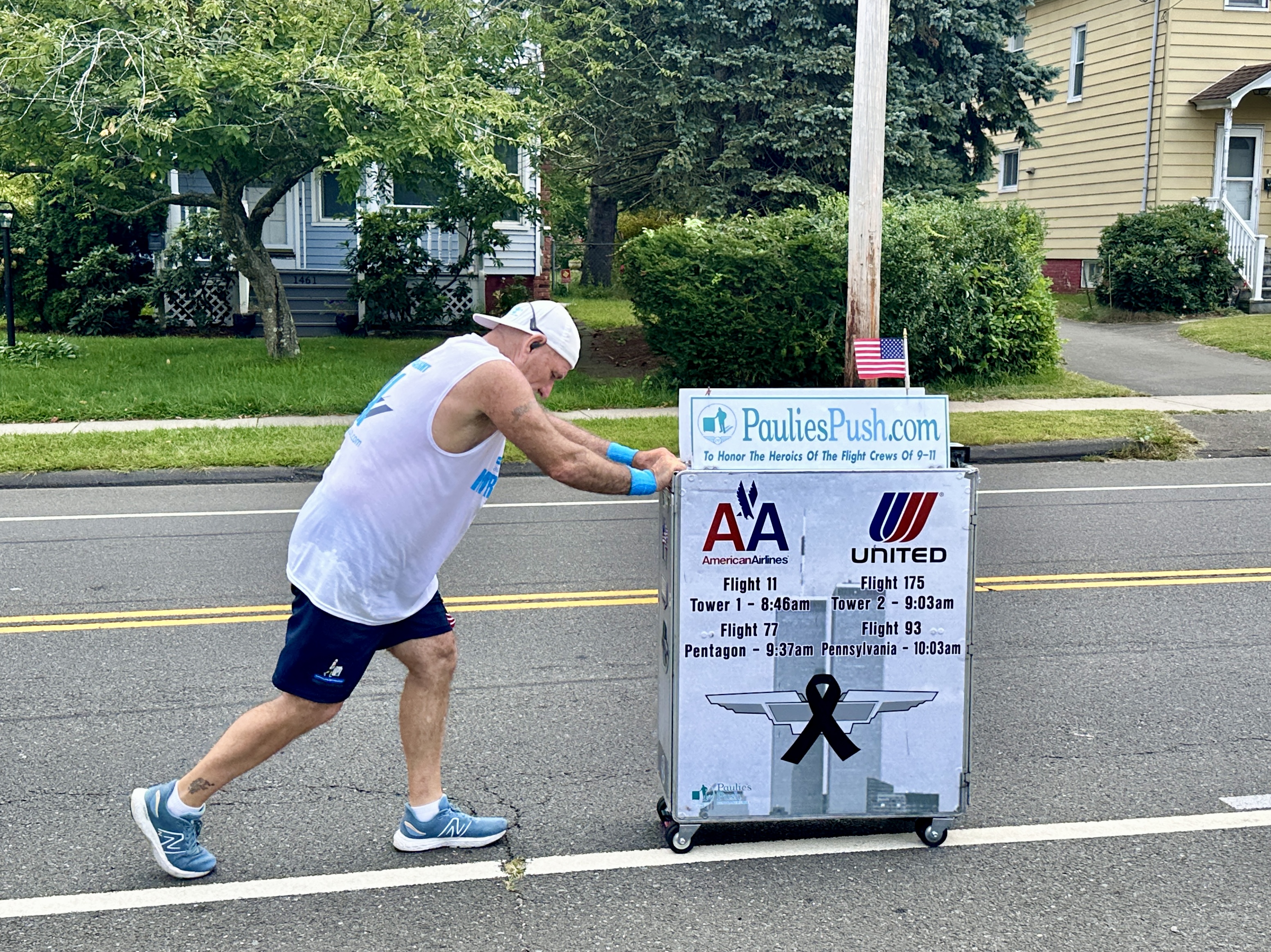 Former flight attendant Paul Veneto pushes an airline drink cart along the routes of the four airplanes hijacked on Sept. 11, 2001.