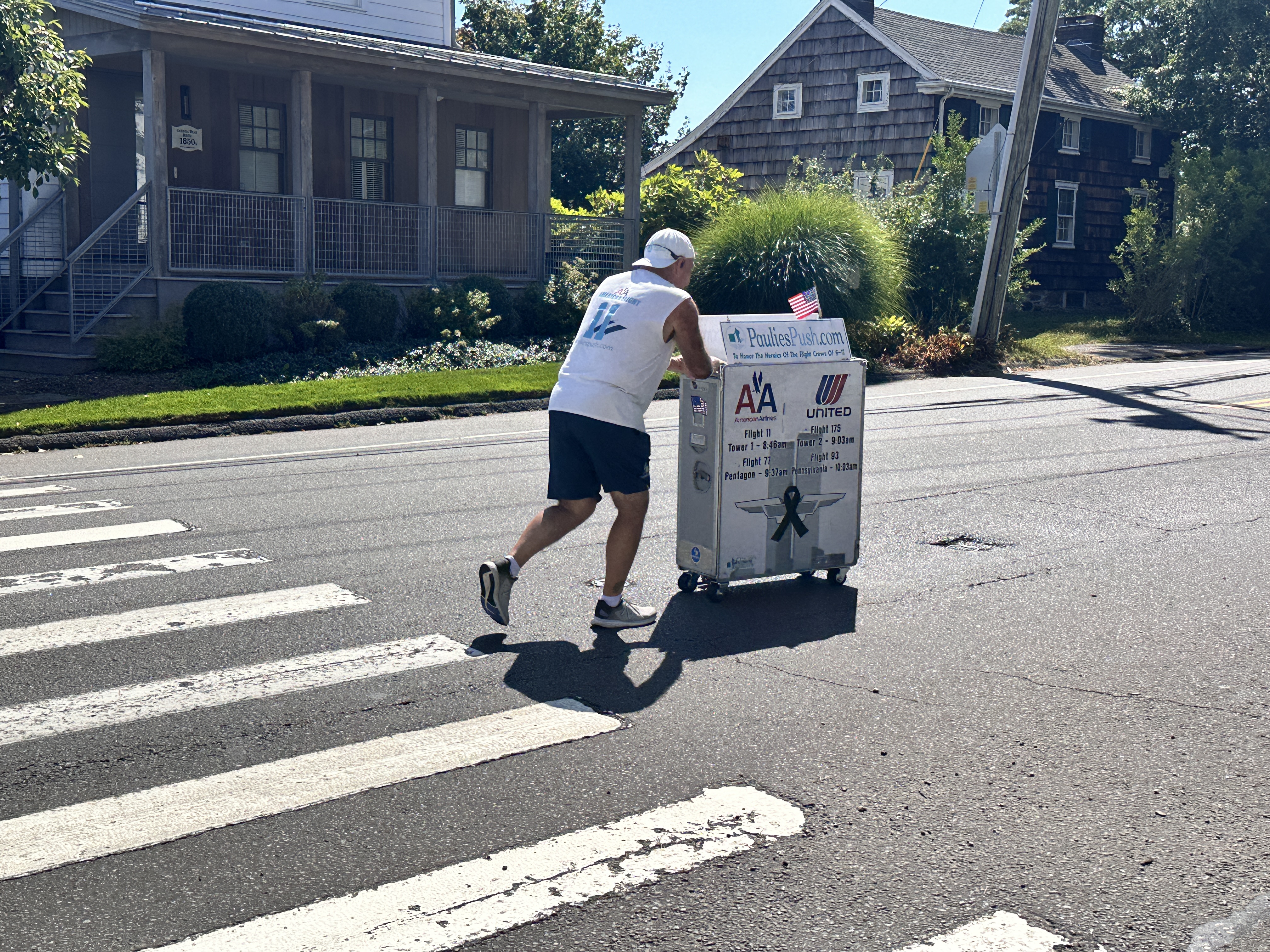 Former flight attendant Paul Veneto pushes an airline drink cart along the routes of the four airplanes hijacked on Sept. 11, 2001.