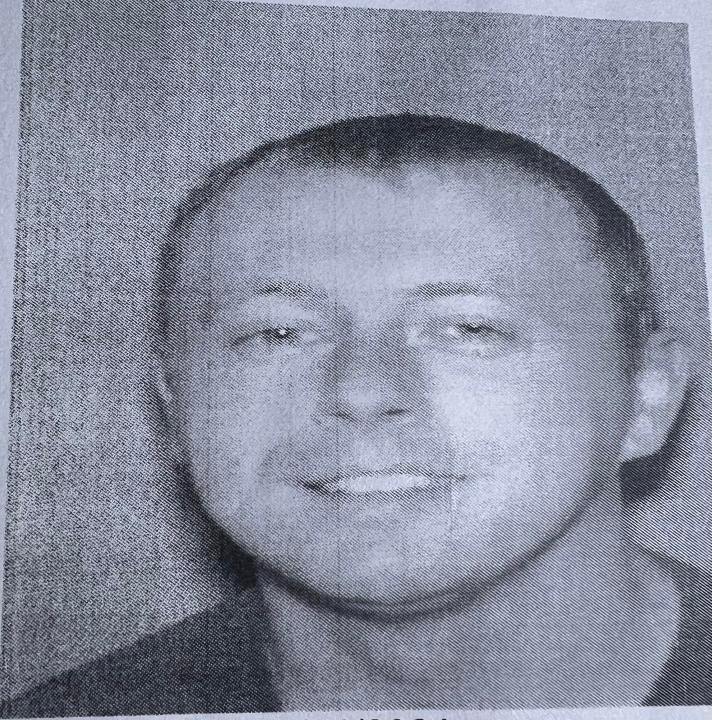 Joseph A. Couch, a person of interest in the Sept. 7 shootings near I-75 in Kentucky, smiles in a black and white photo.