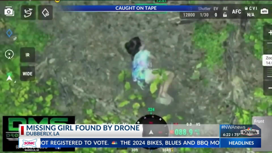 An image from drone video shows a missing 10-year-old in the woods in Louisiana.