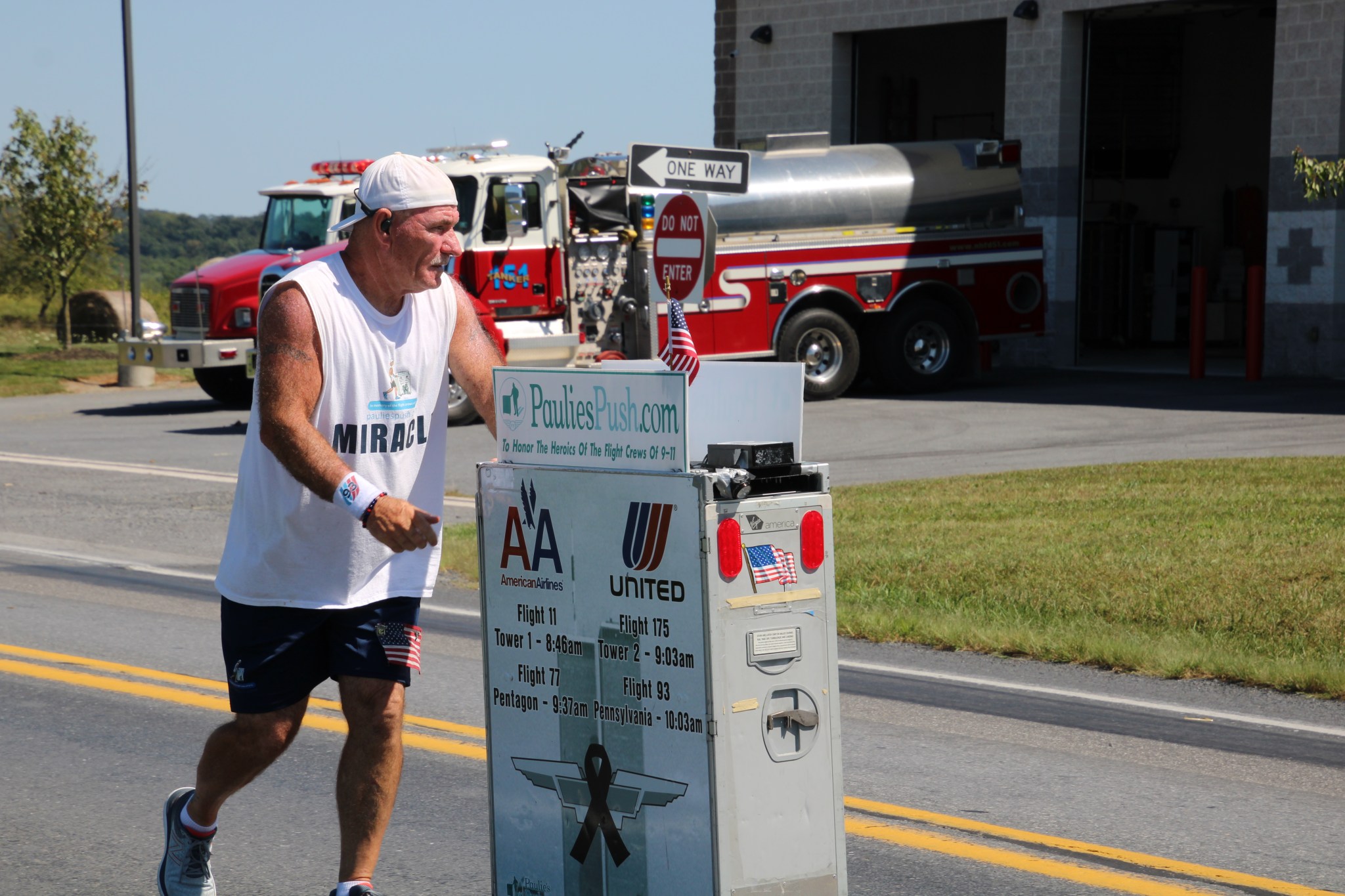 Former flight attendant Paul Veneto pushes an airline drink cart along the routes of the four airplanes hijacked on Sept. 11, 2001.