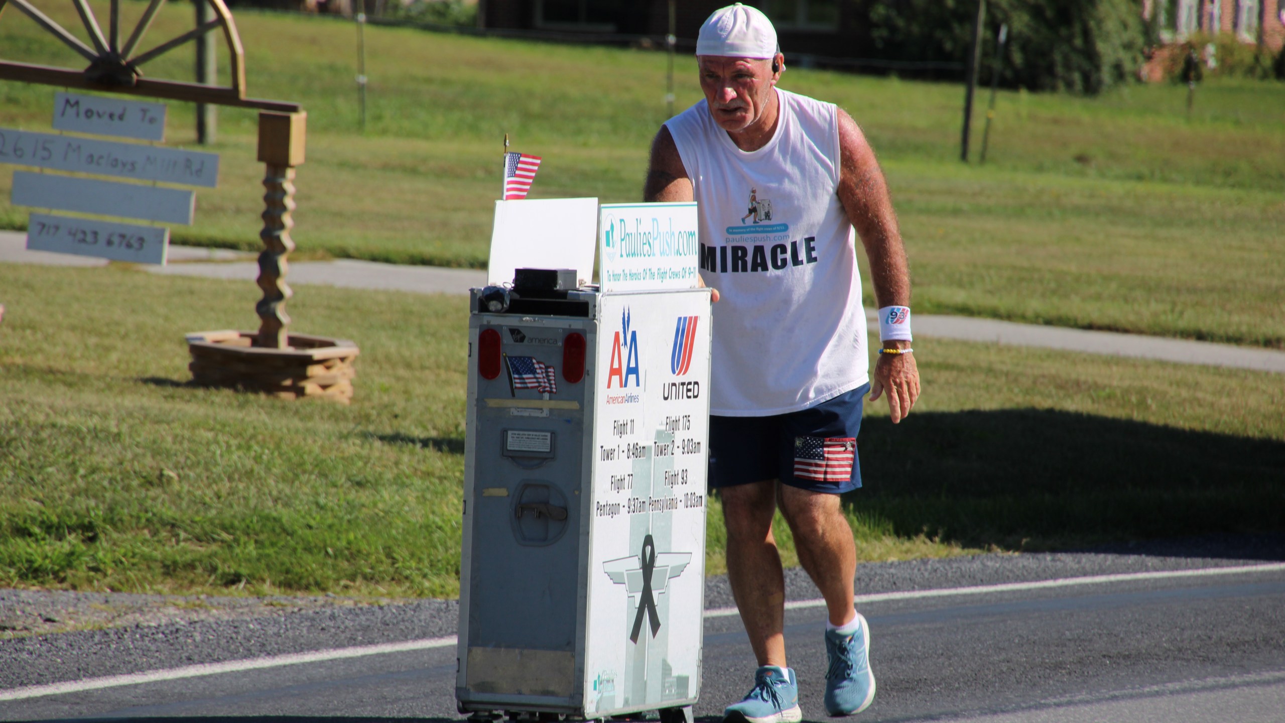 Former flight attendant Paul Veneto pushes an airline drink cart along the routes of the four airplanes hijacked on Sept. 11, 2001.