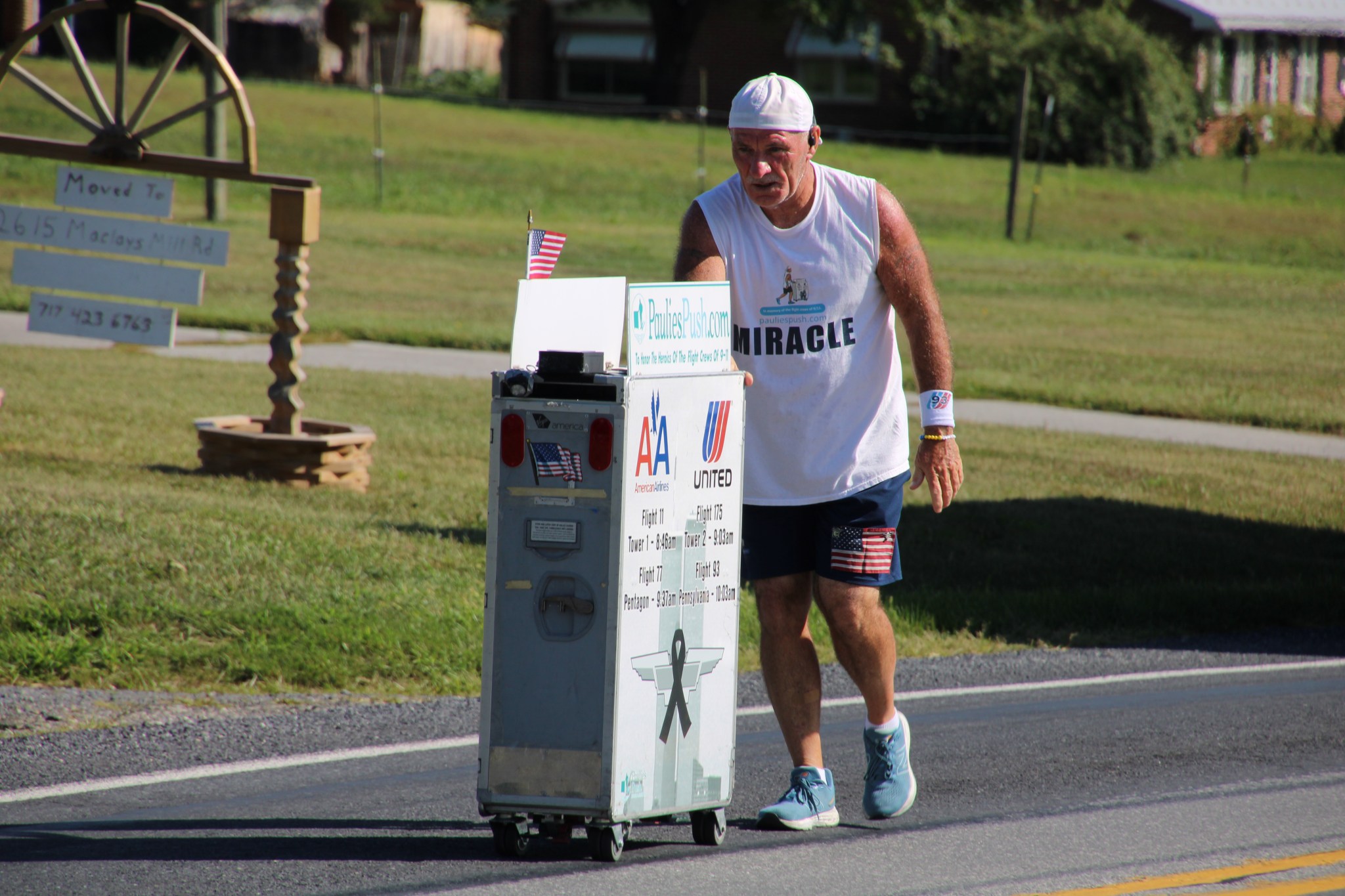 Former flight attendant Paul Veneto pushes an airline drink cart along the routes of the four airplanes hijacked on Sept. 11, 2001.