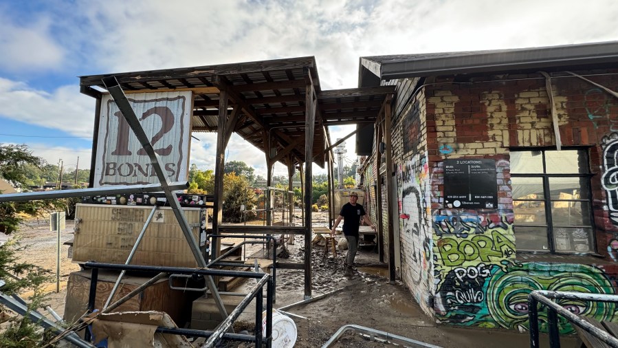 A post-hurricane shot of the damaged exterior of 12 Bones Smokehouse and Brewery in Asheville, North Carolina.