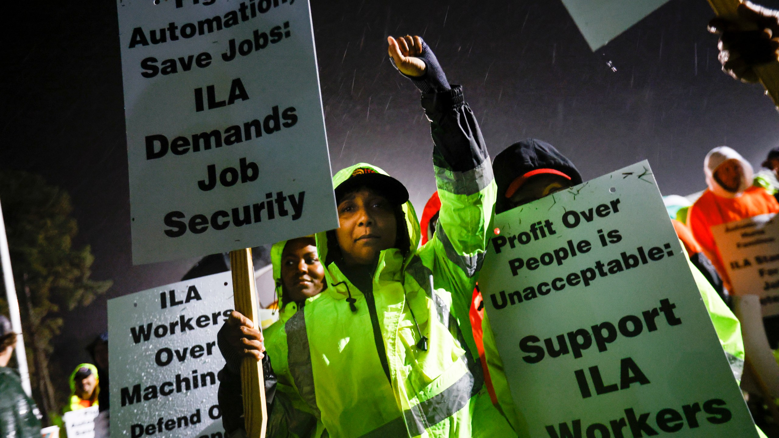 Dockworker Meikysha Wright and others strike outside the Virginia International Gateway in Portsmouth, Va., Tuesday, Oct. 1, 2024. (Billy Schuerman/The Virginian-Pilot via AP)