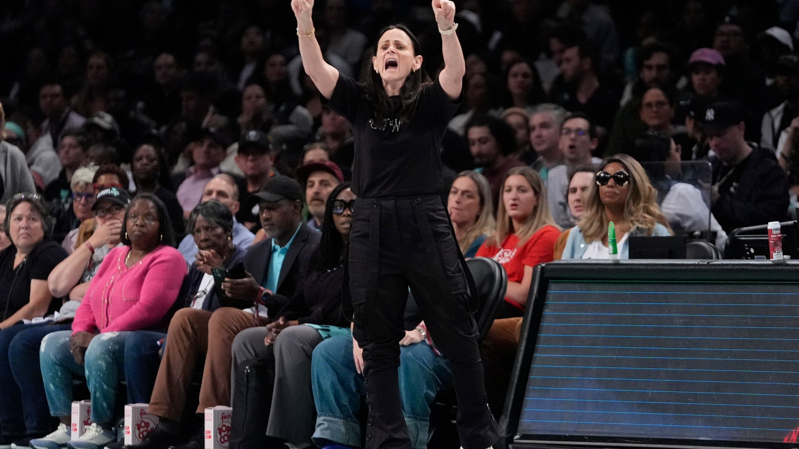 New York Liberty head coach Sandy Brondello calls out to her team during the first half of a WNBA basketball semifinal game against the Las Vegas Aces, Tuesday, Oct. 1, 2024, in New York. (AP Photo/Frank Franklin II)